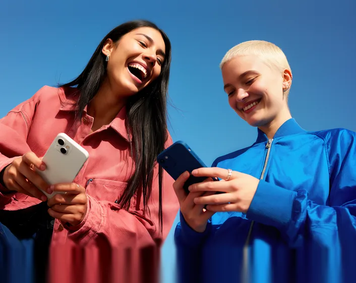 Two people reading a page on their phones